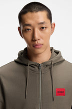 Prenda con capucha de felpa de algodón con cremallera y etiqueta con logo